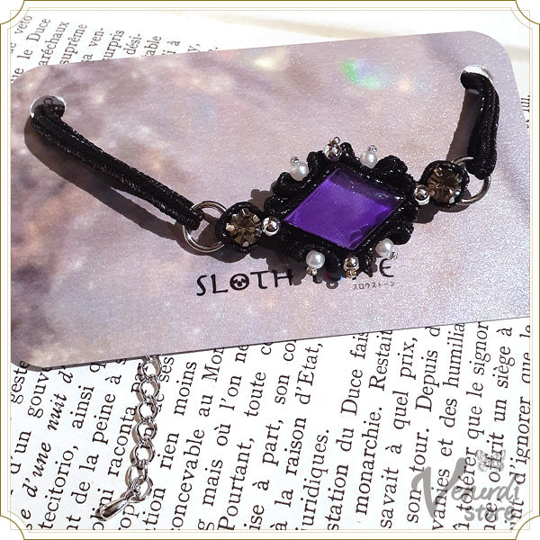 紫と黒のソウタシエのブレスレット